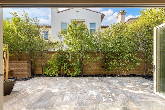 view of patio / terrace featuring fence