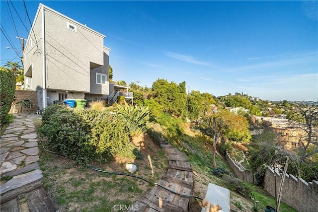 view of home's exterior featuring fence and stucco siding