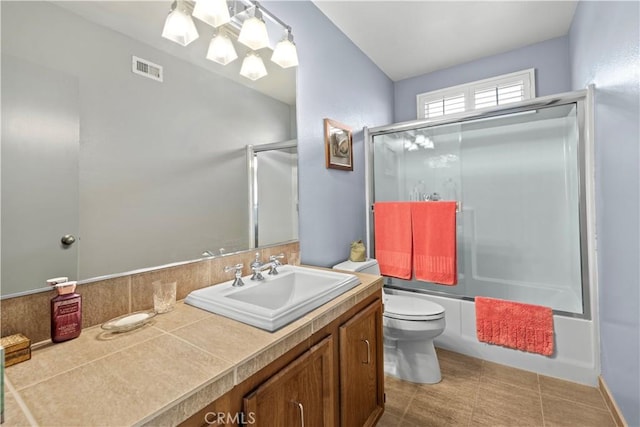 full bath featuring visible vents, enclosed tub / shower combo, toilet, and vanity