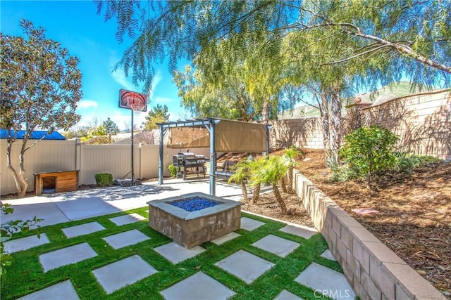 view of yard featuring an outdoor fire pit, a fenced backyard, a pergola, and a patio area