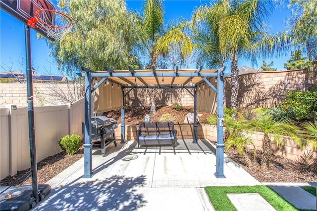 view of patio with a grill, a pergola, and a fenced backyard