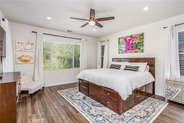 bedroom featuring dark wood-style floors, visible vents, and recessed lighting