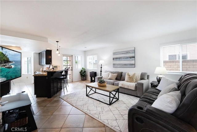 living area featuring light tile patterned floors