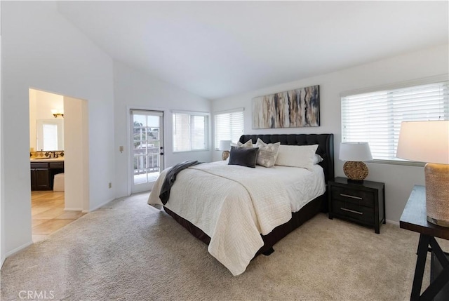 bedroom with high vaulted ceiling, light tile patterned flooring, access to outside, light colored carpet, and connected bathroom