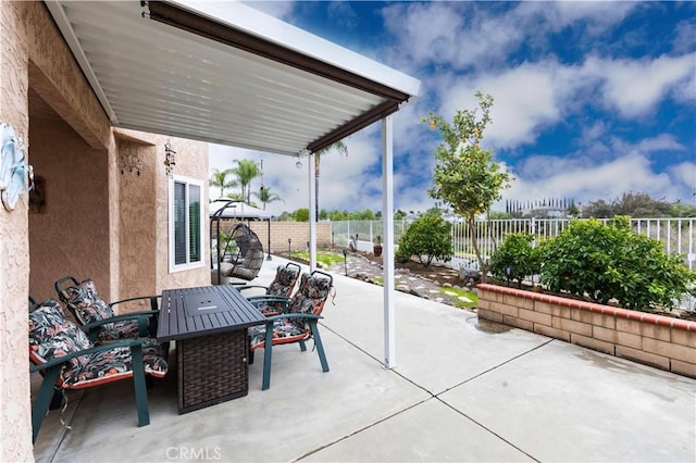 view of patio / terrace featuring outdoor dining area and a fenced backyard