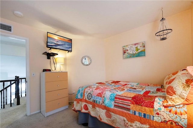 bedroom with visible vents and carpet floors