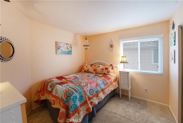 bedroom with baseboards and carpet floors