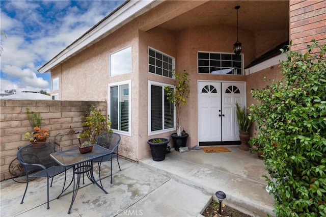 view of patio featuring fence