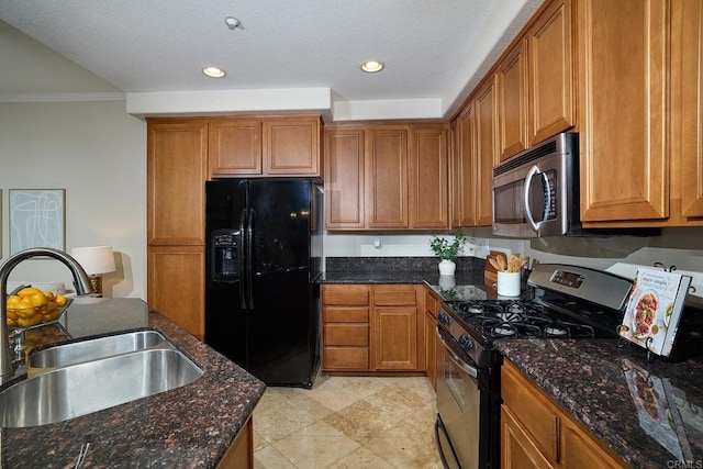 kitchen with ornamental molding, recessed lighting, appliances with stainless steel finishes, brown cabinetry, and a sink