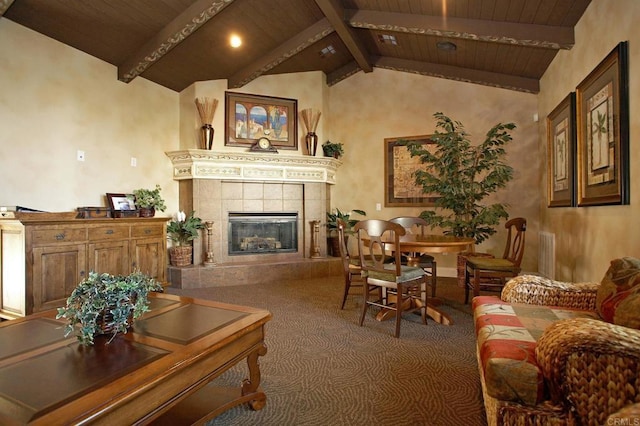 living area with a tiled fireplace, wooden ceiling, vaulted ceiling with beams, and carpet flooring