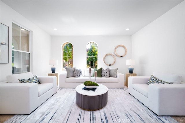 living room with recessed lighting and wood finished floors