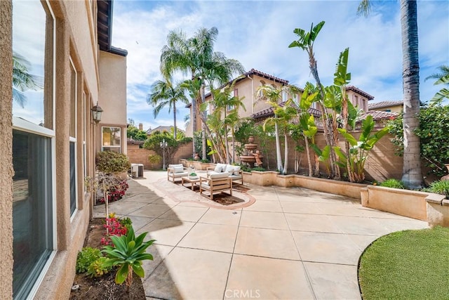 view of patio / terrace featuring an outdoor living space and a fenced backyard