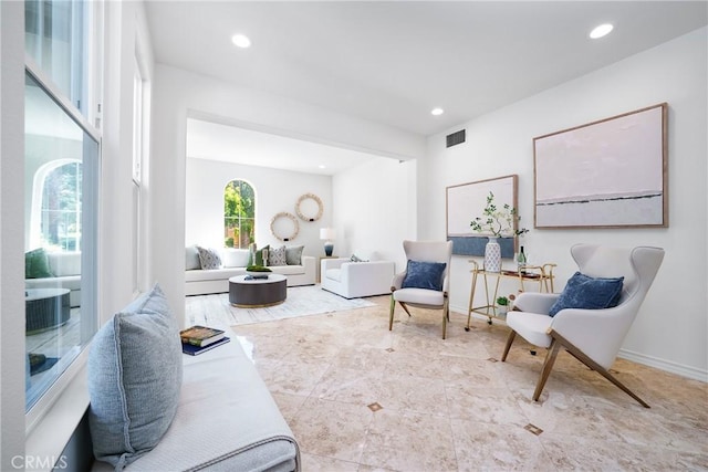 sitting room with recessed lighting, visible vents, and baseboards