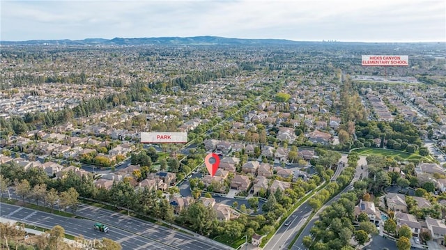 drone / aerial view with a residential view and a mountain view