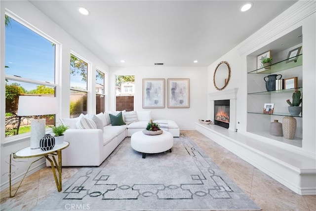 tiled living area featuring recessed lighting, visible vents, built in shelves, and plenty of natural light