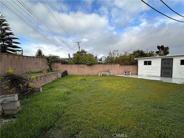 view of yard with a fenced backyard