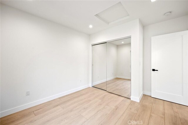 914 N Catalina St, Burbank, CA 91505 - unfurnished bedroom featuring light wood finished floors, attic access, recessed lighting, baseboards, and a closet