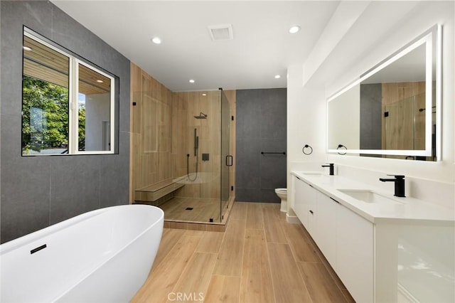 914 N Catalina St, Burbank, CA 91505 - full bathroom featuring a soaking tub, a shower stall, double vanity, toilet, and recessed lighting