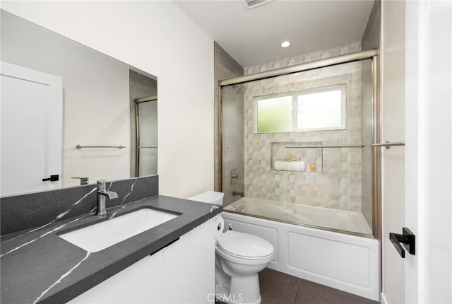 914 N Catalina St, Burbank, CA 91505 - bathroom featuring toilet, vanity, combined bath / shower with glass door, and tile patterned flooring