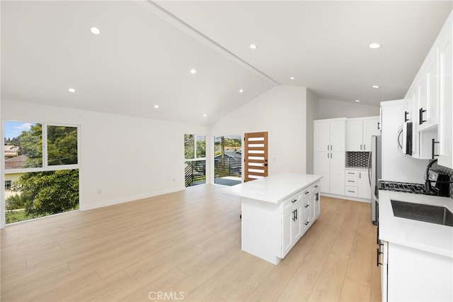 914 N Catalina St, Burbank, CA 91505 - kitchen featuring appliances with stainless steel finishes, a center island, plenty of natural light, light countertops, and recessed lighting