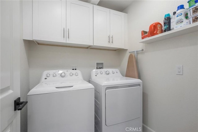 laundry area with cabinet space and washer and dryer