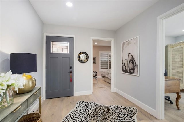 entrance foyer with light wood-style flooring, recessed lighting, and baseboards