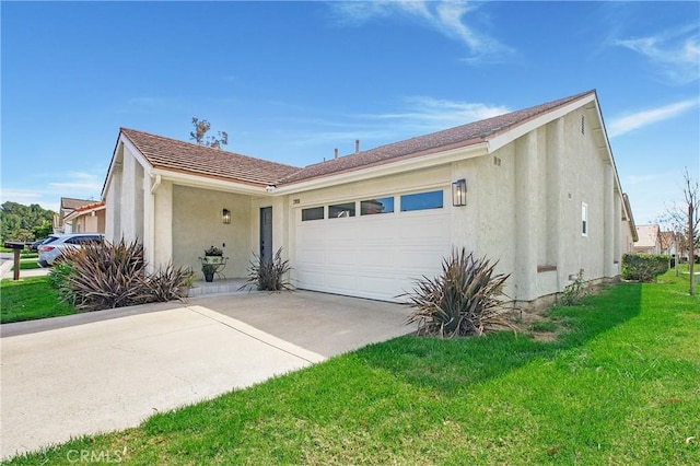 ranch-style home featuring a garage, concrete driveway, a front lawn, and stucco siding