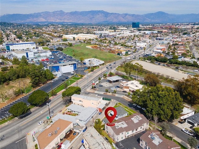 birds eye view of property with a mountain view