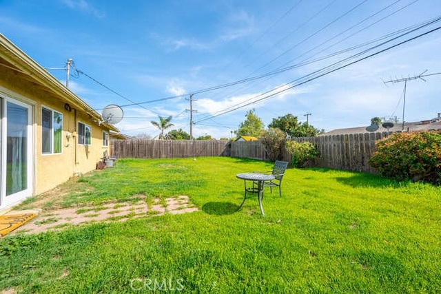 view of yard with a fenced backyard