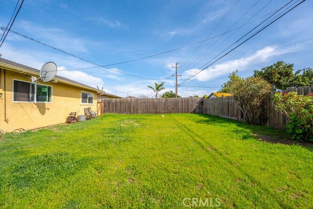 view of yard featuring a fenced backyard