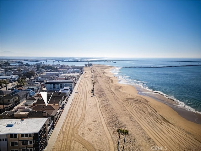 aerial view with a water view and a beach view