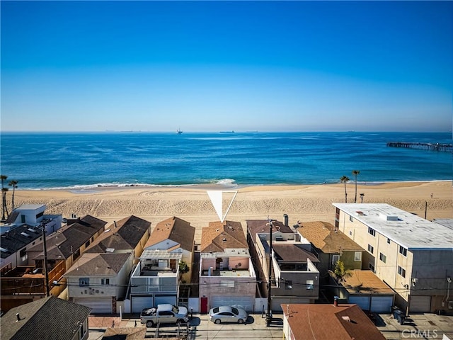 view of water feature with a residential view and a view of the beach