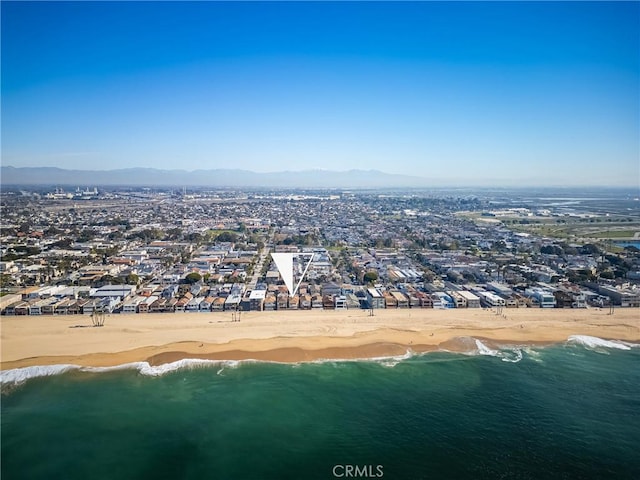 bird's eye view featuring a water and mountain view and a view of the beach