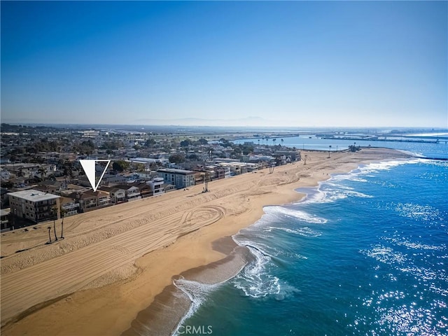 aerial view featuring a view of the beach and a water view