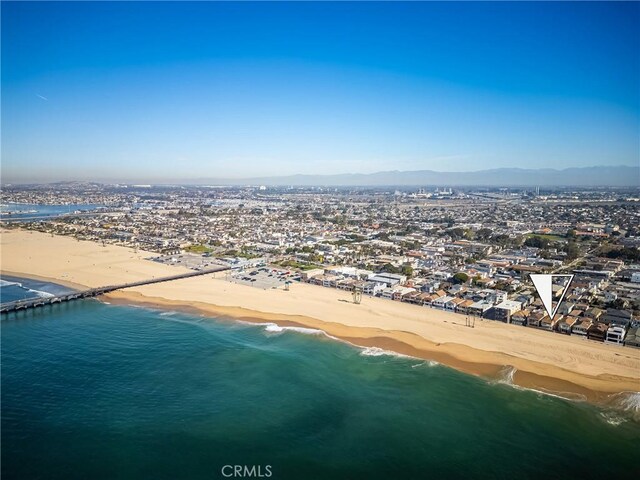 bird's eye view with a water and mountain view and a view of the beach