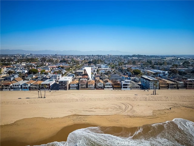 drone / aerial view with a residential view and a water and mountain view