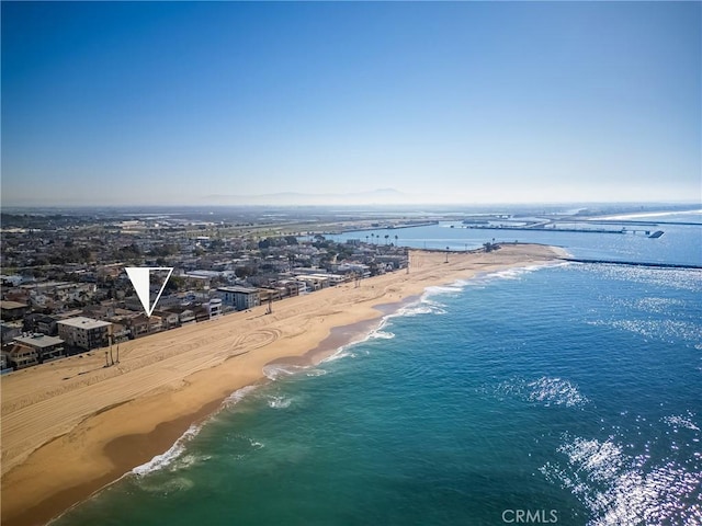 birds eye view of property featuring a view of the beach and a water view