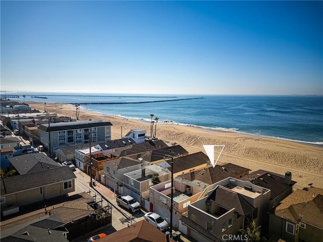 bird's eye view with a view of the beach, a water view, and a residential view