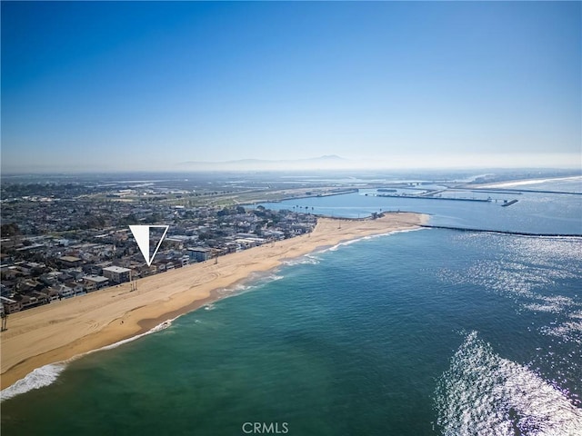 drone / aerial view with a beach view and a water view