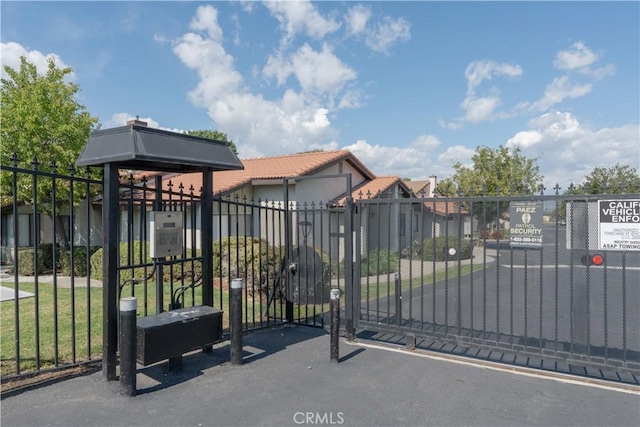 view of gate with fence