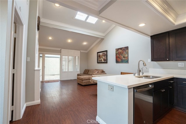 kitchen featuring ornamental molding, a sink, stainless steel dishwasher, dark wood-style floors, and a peninsula