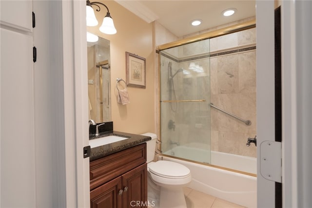 bathroom with vanity, shower / bath combination with glass door, toilet, and tile patterned flooring