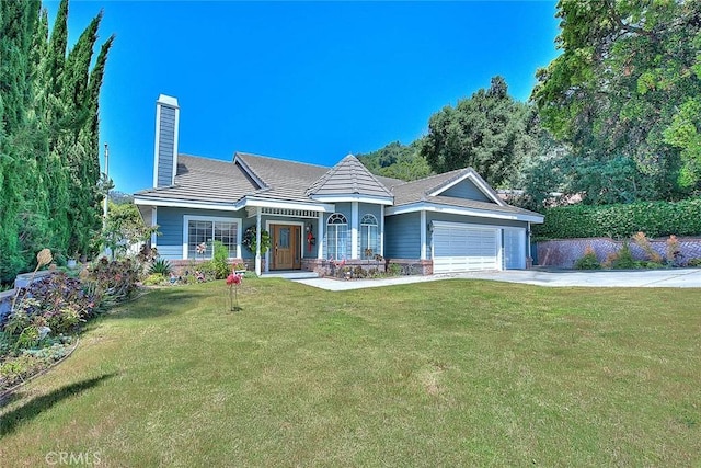 view of front of home with concrete driveway, a front yard, an attached garage, a chimney, and a tiled roof