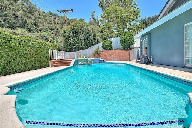 view of pool featuring a fenced in pool and a fenced backyard