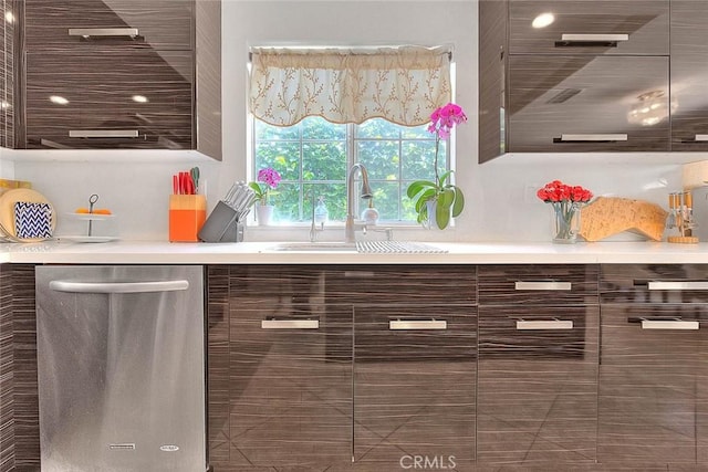 interior space featuring a sink, modern cabinets, light countertops, and stainless steel dishwasher