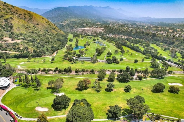 bird's eye view featuring a mountain view and view of golf course