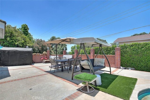 view of patio / terrace with outdoor dining area and fence