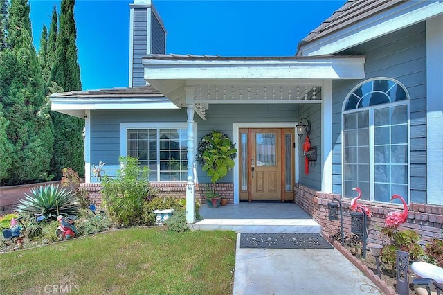 entrance to property with brick siding