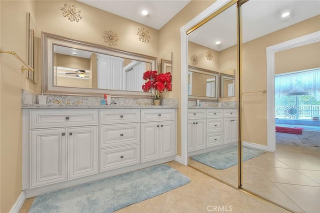 bathroom with tile patterned flooring, recessed lighting, vanity, and baseboards