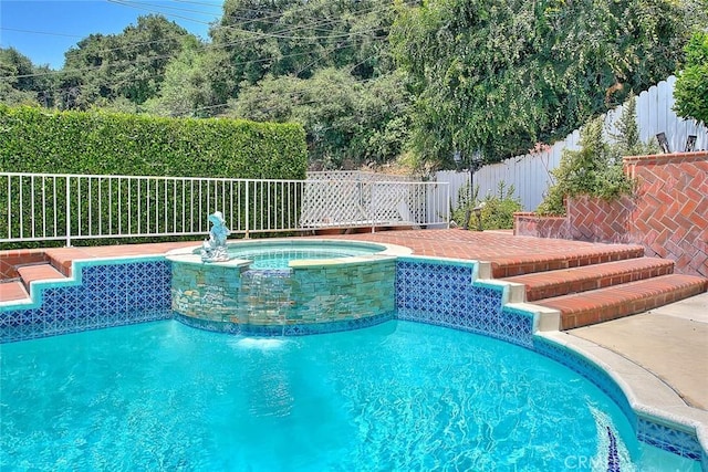 view of pool with a fenced in pool, an in ground hot tub, and a fenced backyard